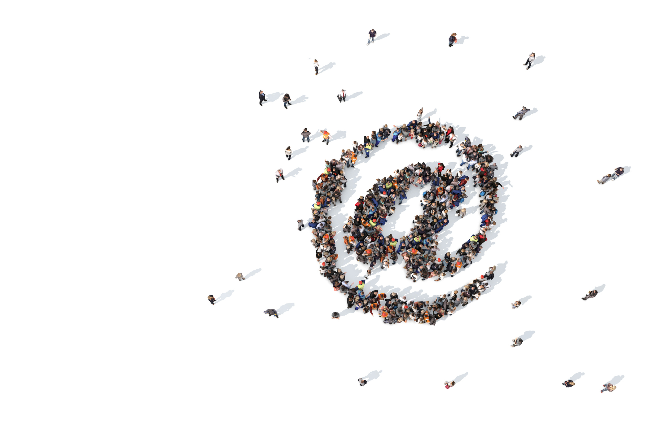 Large collection of people grouped together to form an email at symbol